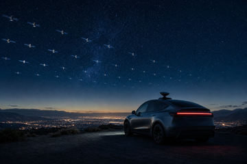 Satellites over a highway at night beside a parked electric car with a rooftop dish