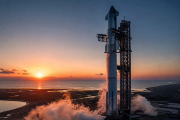 SpaceX Starship on launch pad at dawn with venting vapor