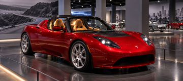 Tesla Roadster prototype on display at Petersen Museum with illuminated cockpit
