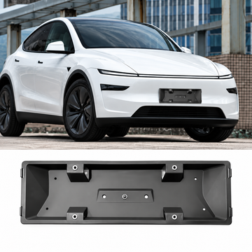 A white electric vehicle is shown in an outdoor urban setting, with a black rectangular license plate frame product displayed below on a plain white background.