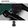 Jack pad positioned at a vehicle lift point above a small case holding four pads