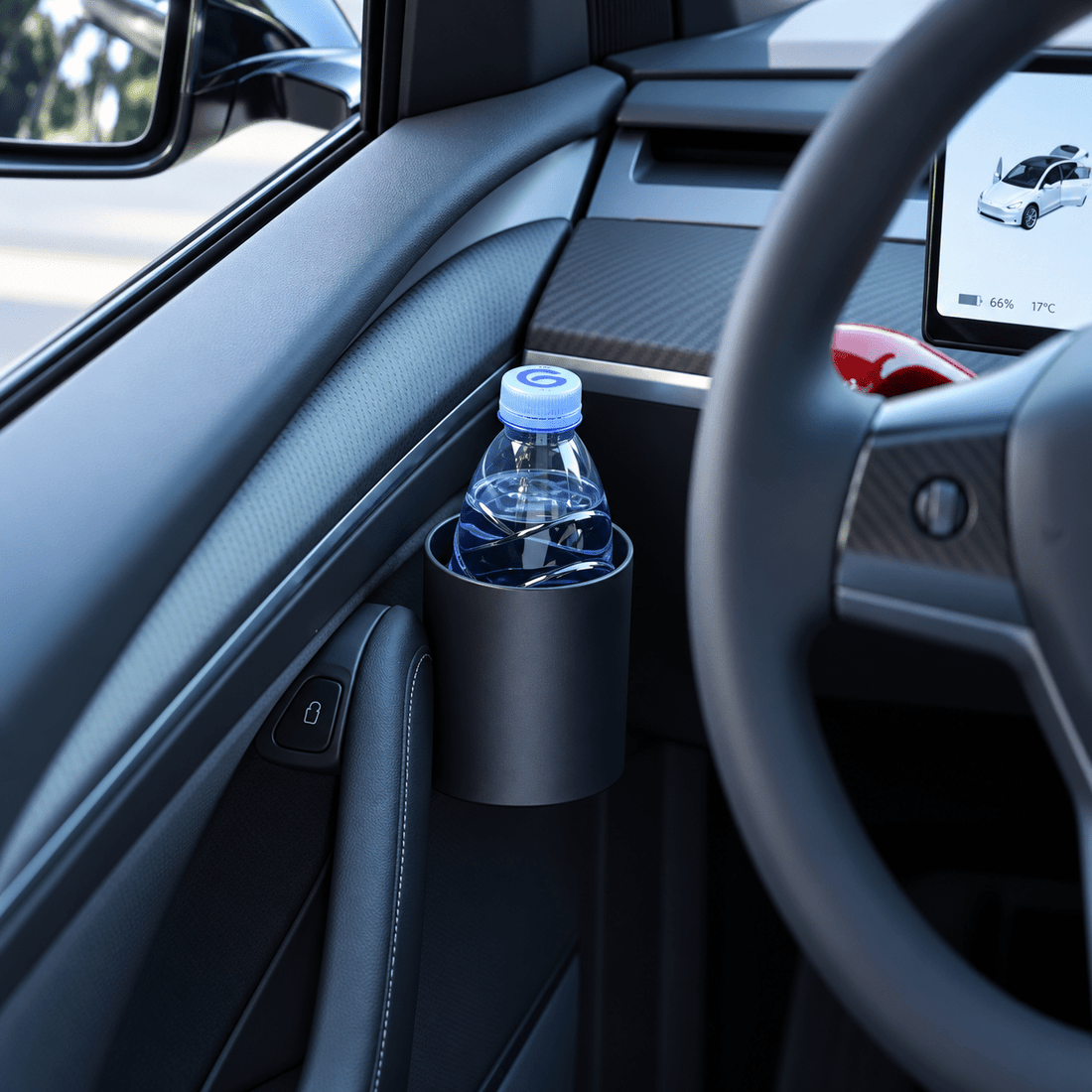 Empty black cylindrical cup holder mounted beside the interior door pull on a dark Tesla door panel.