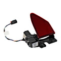 Angled view of the red reflector door on its black mounting body with wiring extending to the left.