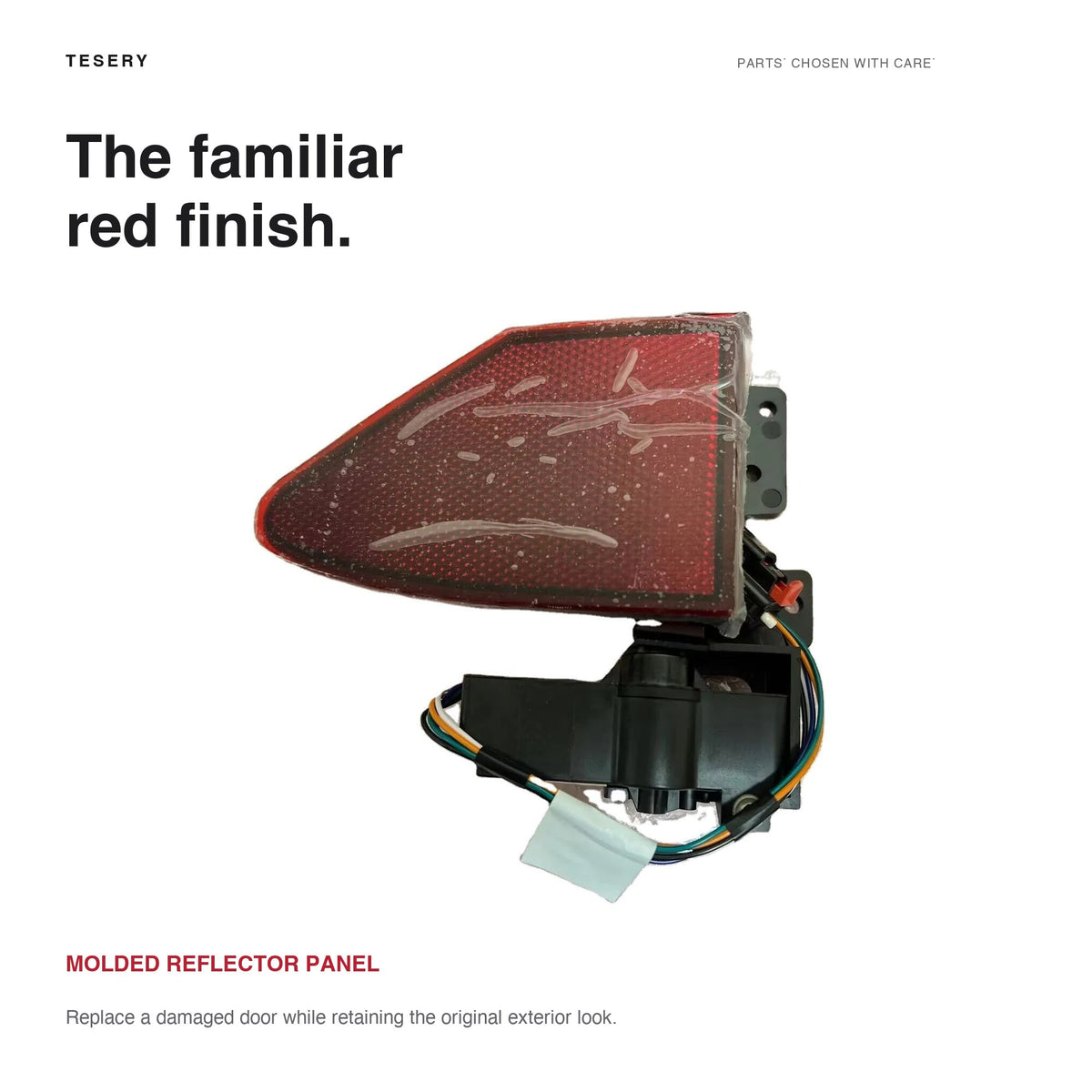 Close view of the red reflector door above the black actuator housing and attached wiring.