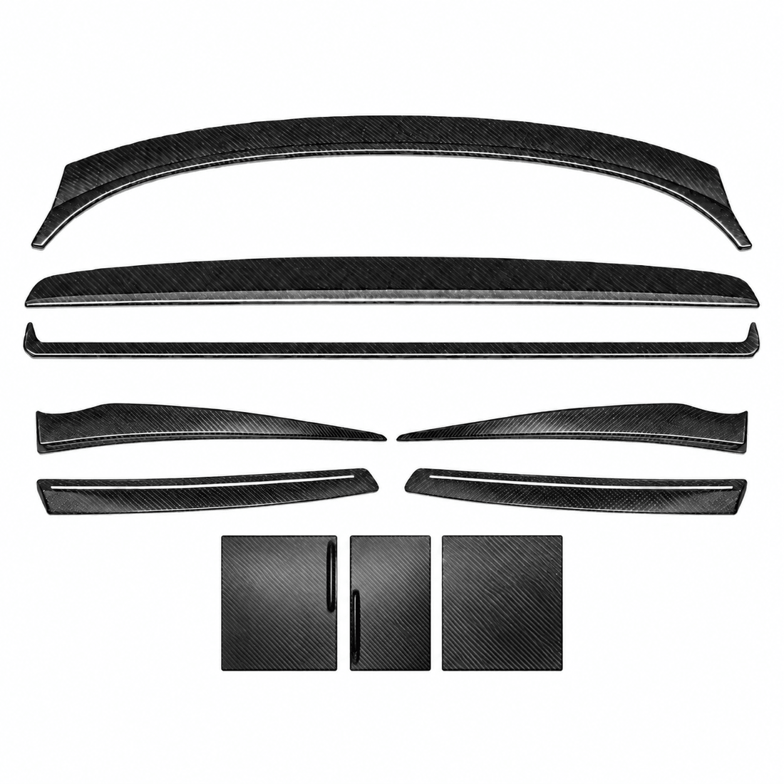 Ten carbon fiber interior covers arranged on white: three dashboard pieces, four door-trim pieces and three center-console panels.