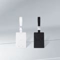White and black rectangular key-card sleeves with matching loop straps and square silver fittings.