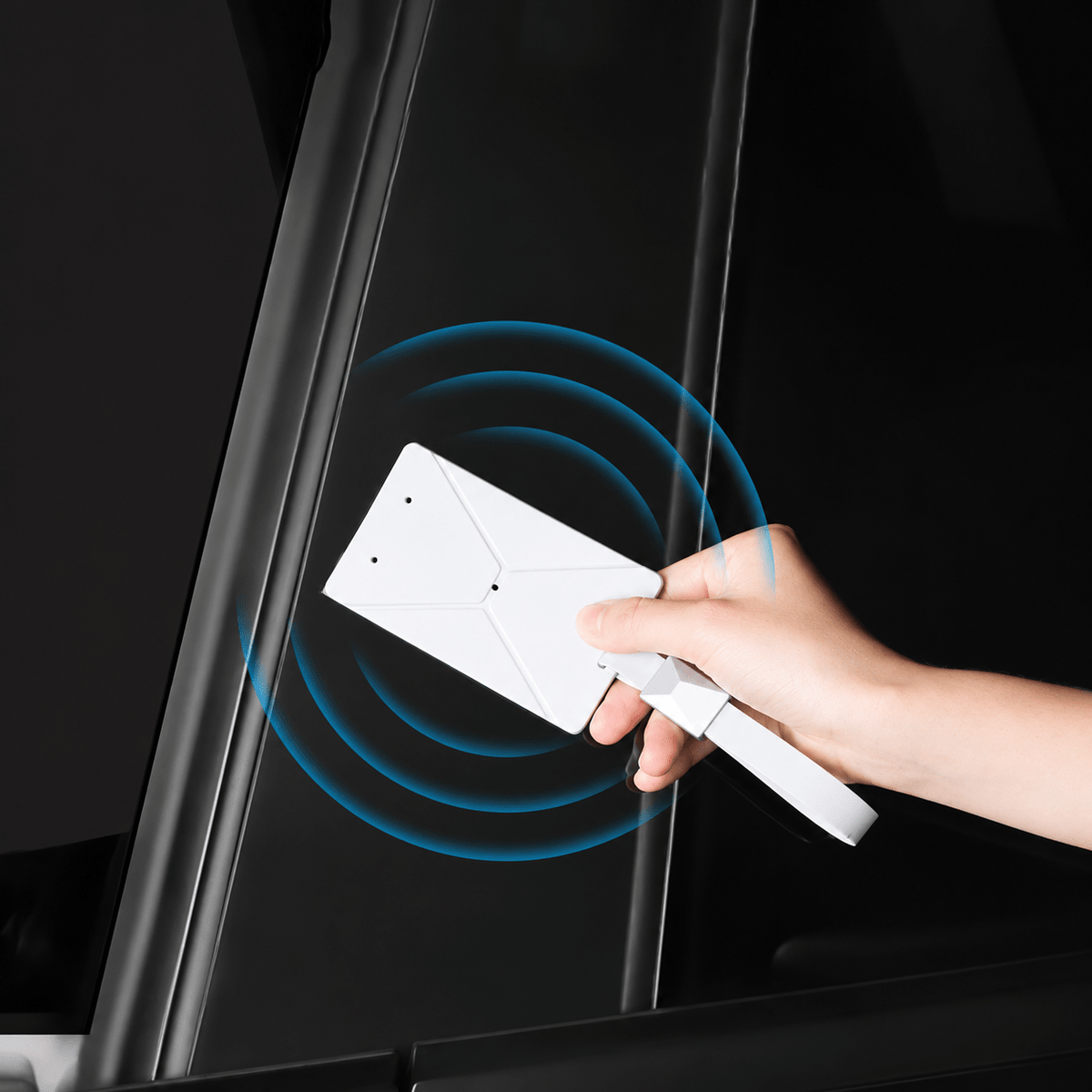 Hand holding a white key-card sleeve near a door pillar, with blue signal-wave graphics.