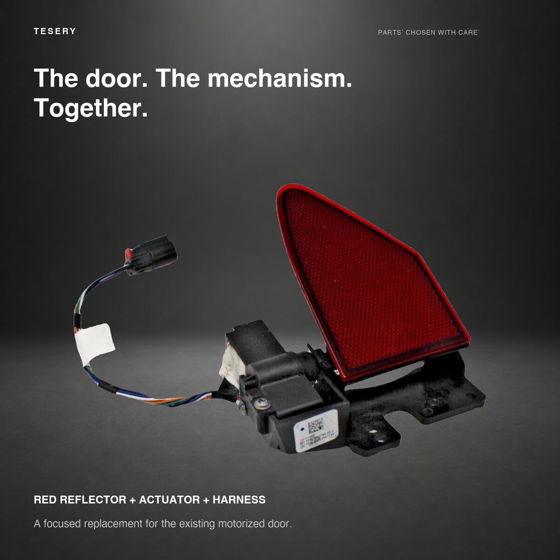 Model S charge port door assembly with red reflector, black actuator and attached wiring on white background